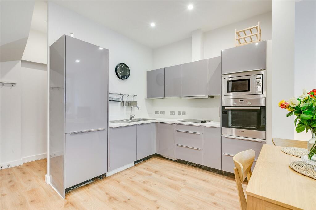 £1.300 all in. Bright single room with desk.